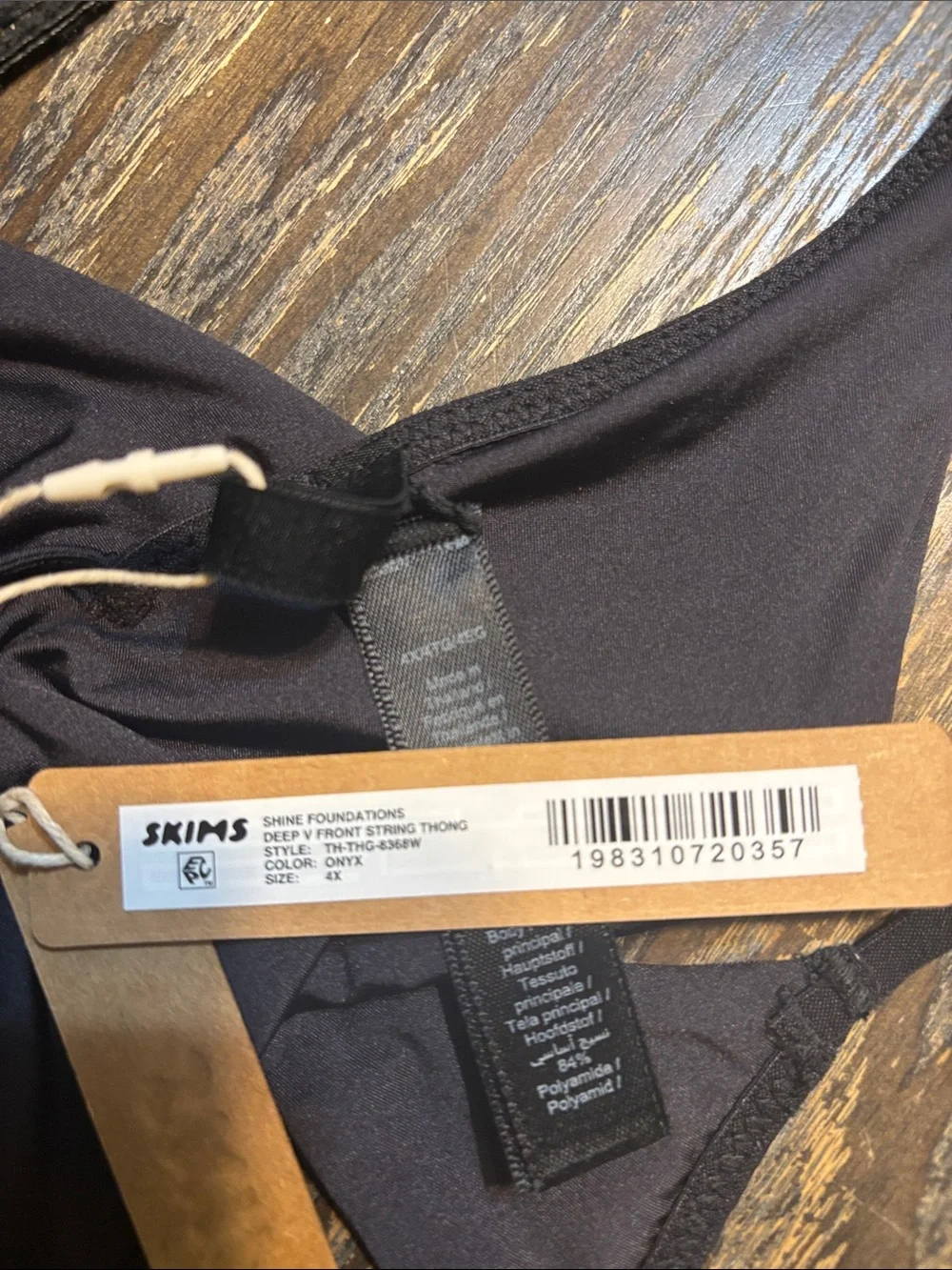 SKIMS onyx 4X shine foundation deep V front string thong